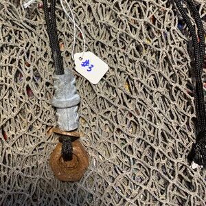 Post apocalyptic industrial hardware necklace on a black pair a cord